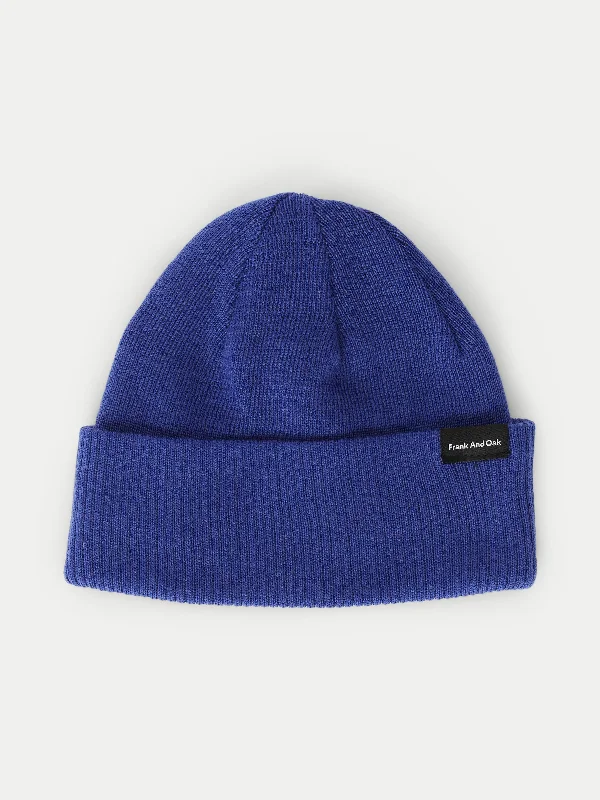 Men's snow jacket with a camo print for a trendy lookThe Merino Wool Beanie in Blue
